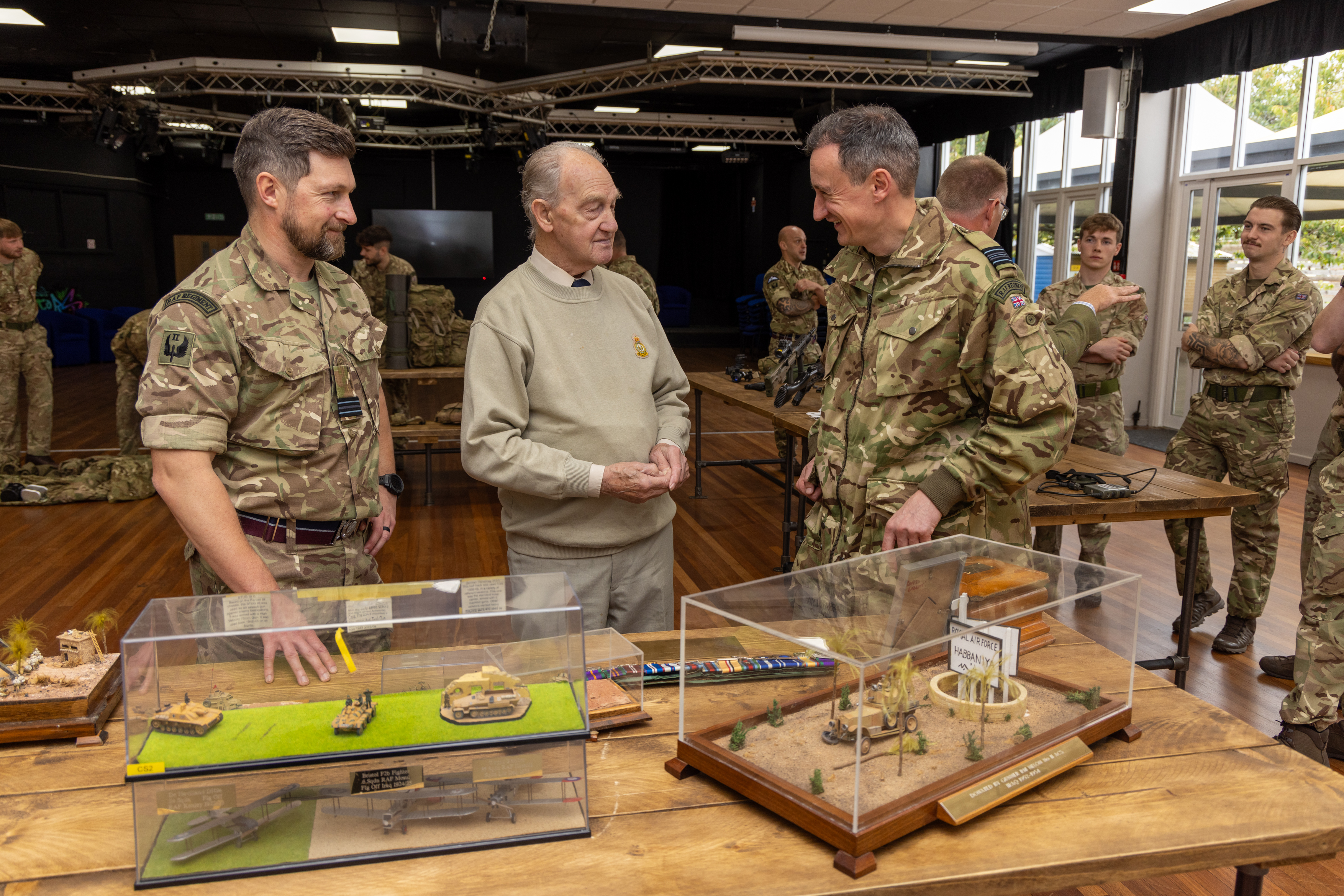 Photo: Mr Hill viewing Squadron historical artefacts, many of which, Mr Hill had built himself whilst serving